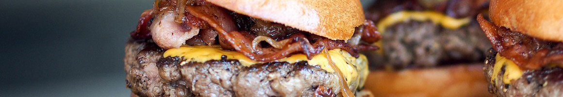 Eating Burger Chicken Wing Pub Food at BoomerJack's Grill & Bar restaurant in Arlington, TX.